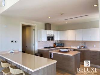 Spacious guest bedroom with private balcony and Pacific views in beach penthouse Punta Arena