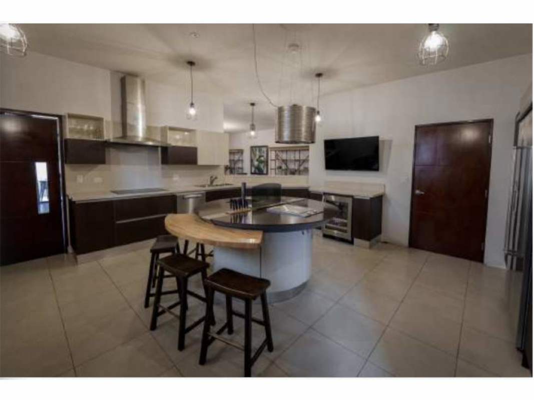 Spacious modern kitchen with island and high-end appliances Embassy Club Clayton