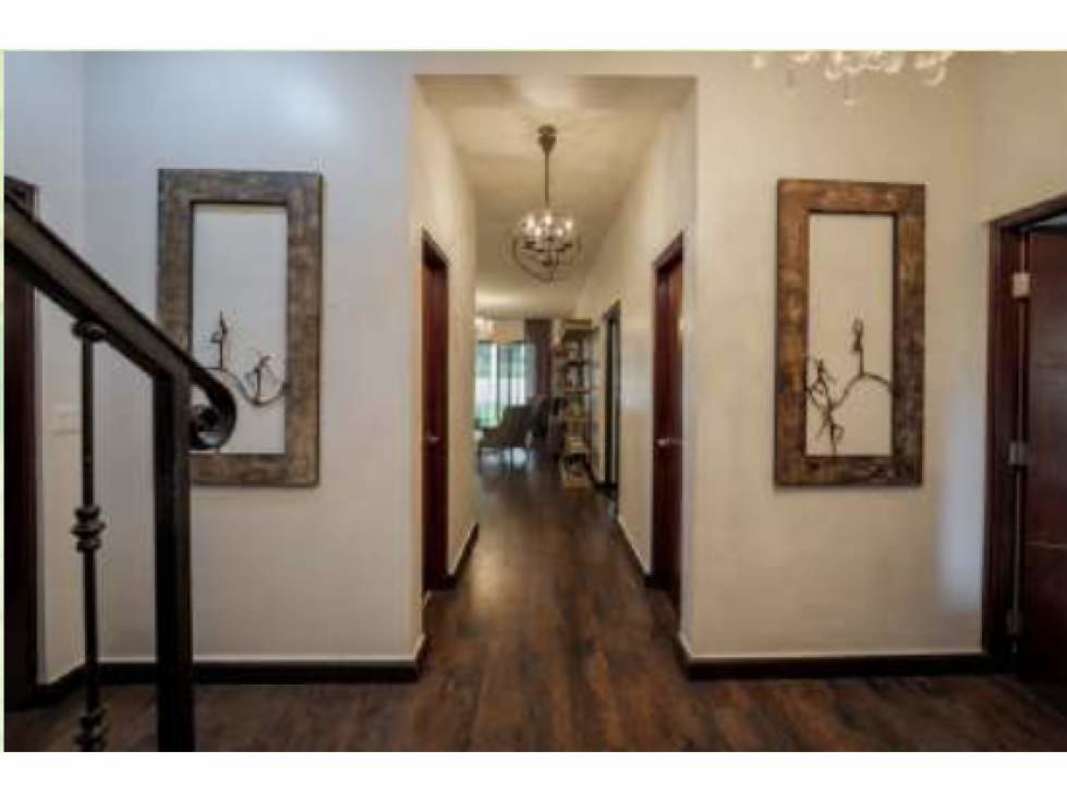 Spacious home office with large windows and wood floors Embassy Club Clayton Panama