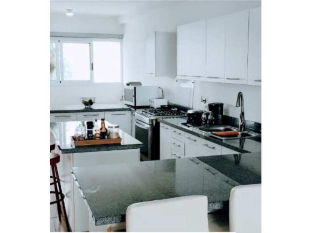 Modern kitchen with granite countertops and appliances in Waters on the Bay Panama City