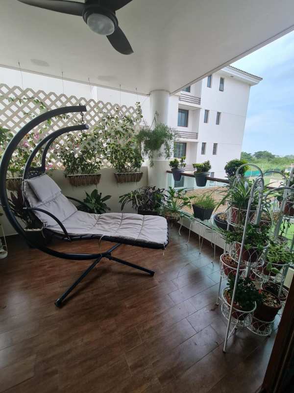 Bedroom with dark accent wall bright window PH Costa Sur Gardens Panama