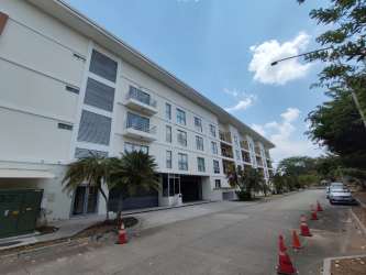 Contemporary building lobby with elevators and lounge seating PH Soleo Panama Pacifico
