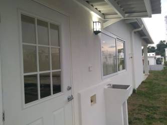 Green backyard garden area with utility sink The Village Beach Residence San Carlos Panama