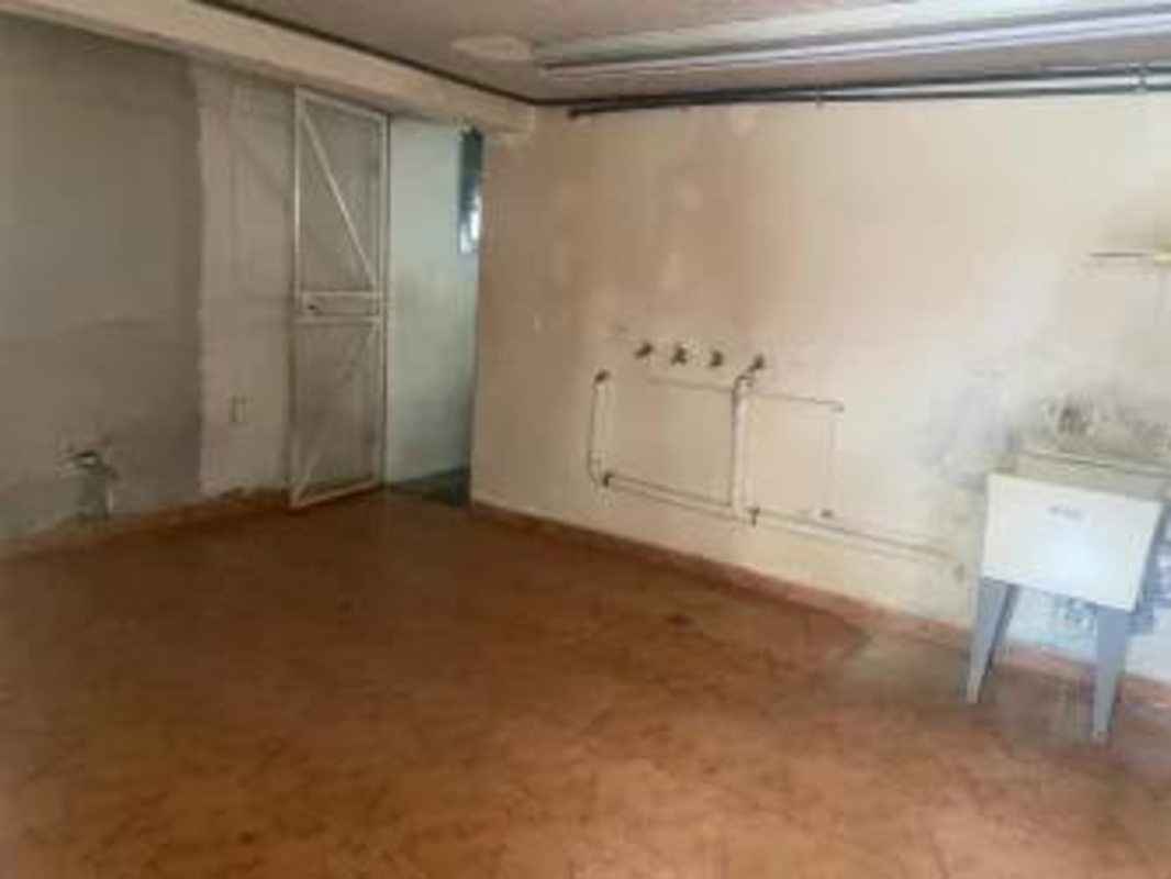 Utility kitchen space with white tile and industrial finish commercial Panama City