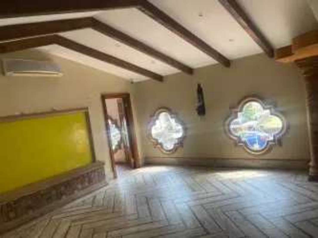 Event or dining area with exposed beams and decorative floor tiles in Bella Vista Panama City