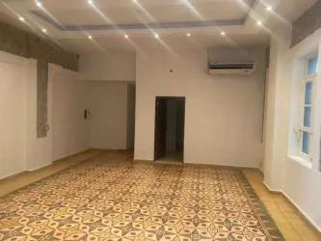 Large tiled dining interior with AC and window in Bella Vista commercial property Panama