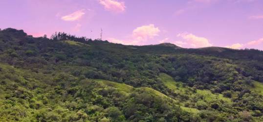 Lush green hills mountain landscape with dense vegetation at Campana Capira Panama land for sale
