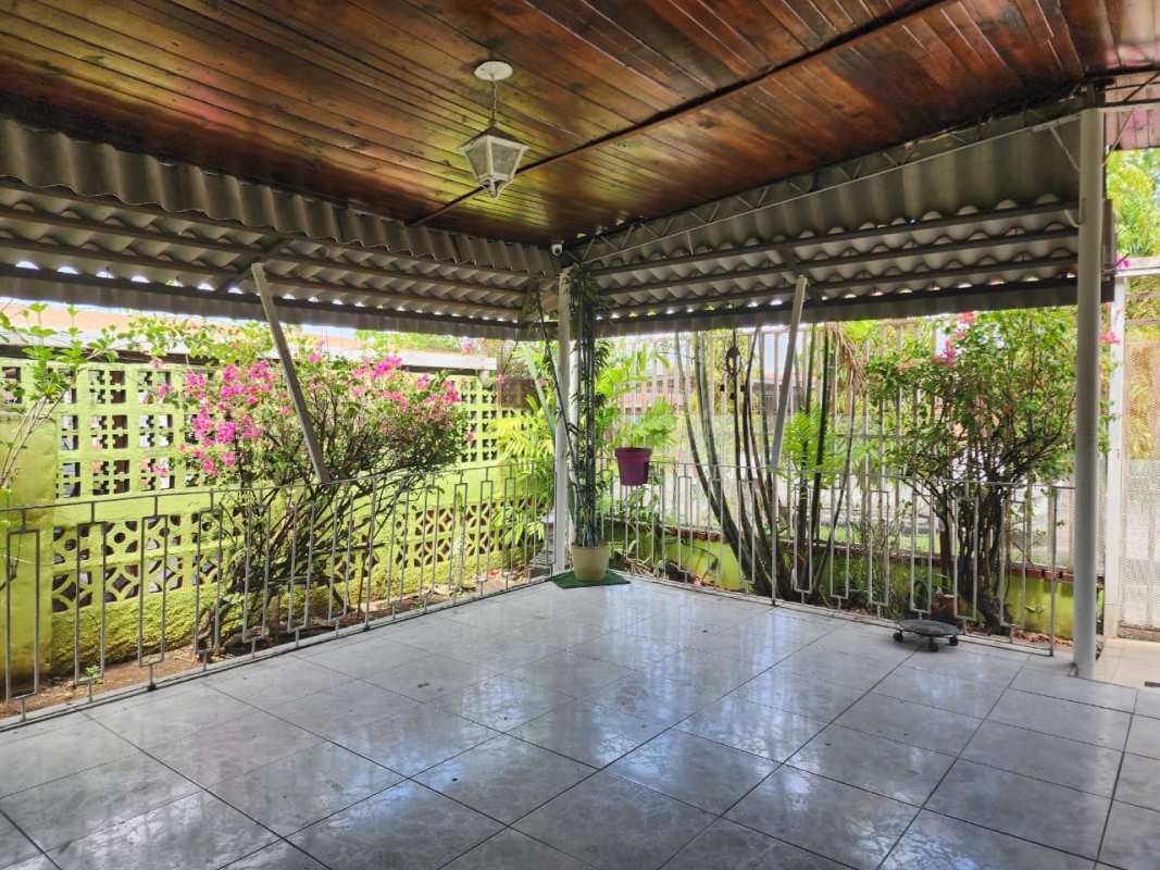 Dining room with tiled floor wooden ceiling chandelier and large windows Villa Rica Panama