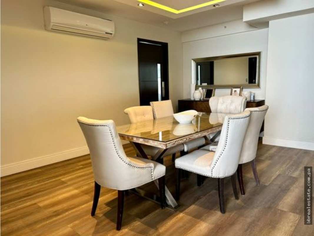 Elegant dining room with marble tile floors and contemporary lighting in PH Costa del Este Country Club Panama