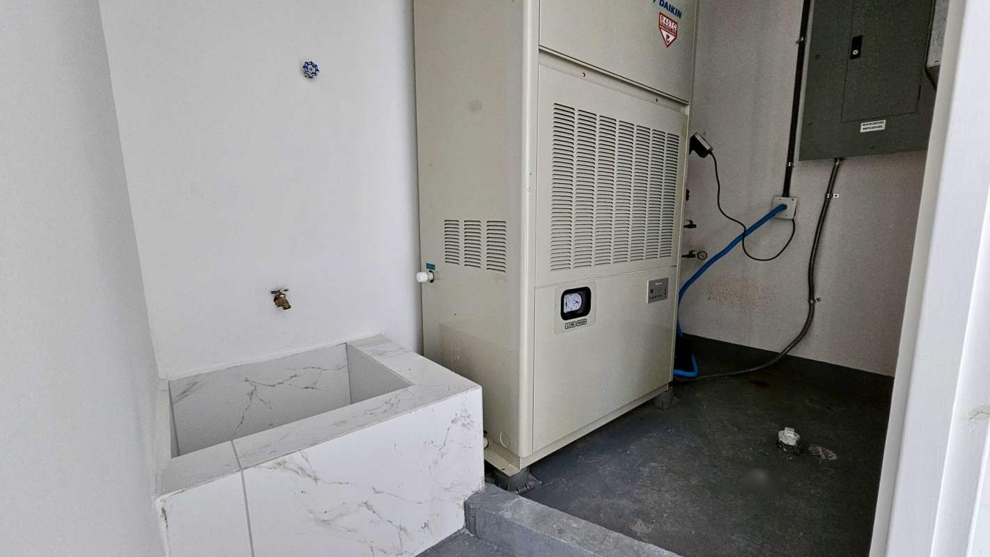 Large empty commercial office in Sortis Business Tower with marble tile floors and drop ceiling Panama