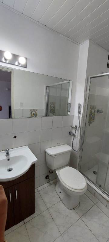 Modern minimalist bathroom with glass shower enclosure and vanity PH Campo Lindbergh Panama