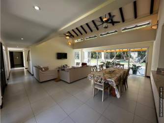 Vaulted exposed beam ceiling living space in resort rental villa Farallon Panama