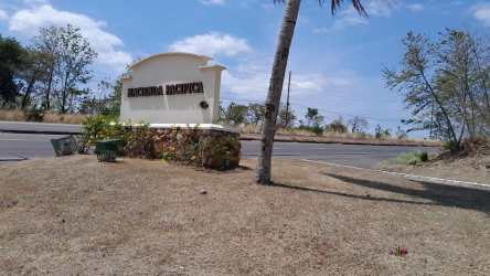 Main entrance gate and sign to Hacienda Pacífica residential community San Carlos Panama