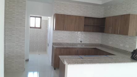 Kitchen interior granite countertops wooden cabinets tiled walls in house Hacienda Pacífica San Carlos Panama