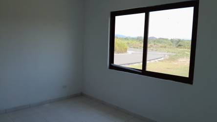Bedroom with natural light tile floor and closet in house Hacienda Pacífica San Carlos Panama