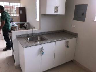 Bathroom with white tile, toilet, and walk-in shower Costa Verde Panama