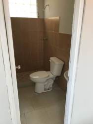 Exterior of small beige house with yard and driveway Loma Linda Costa Verde Panama