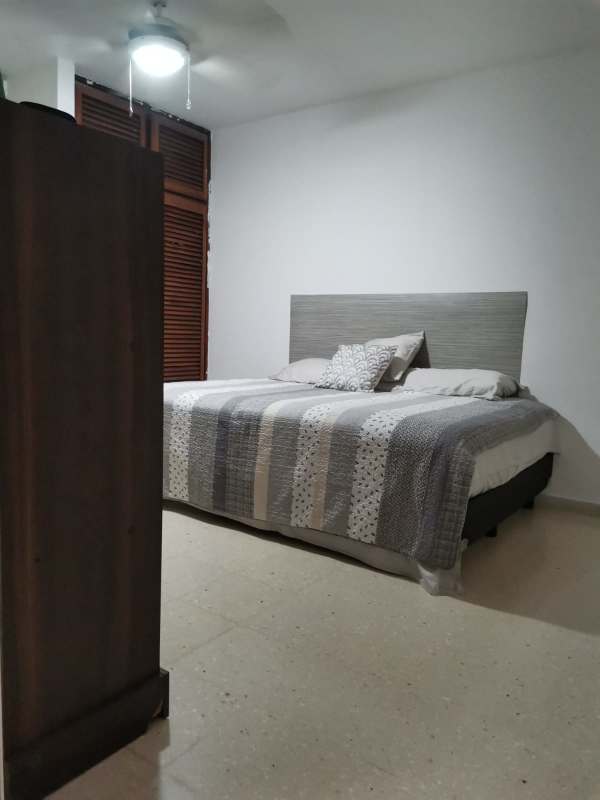 Contemporary bedroom featuring closet, ceiling fan and neutral design PH BICSA Financial Center Panama City