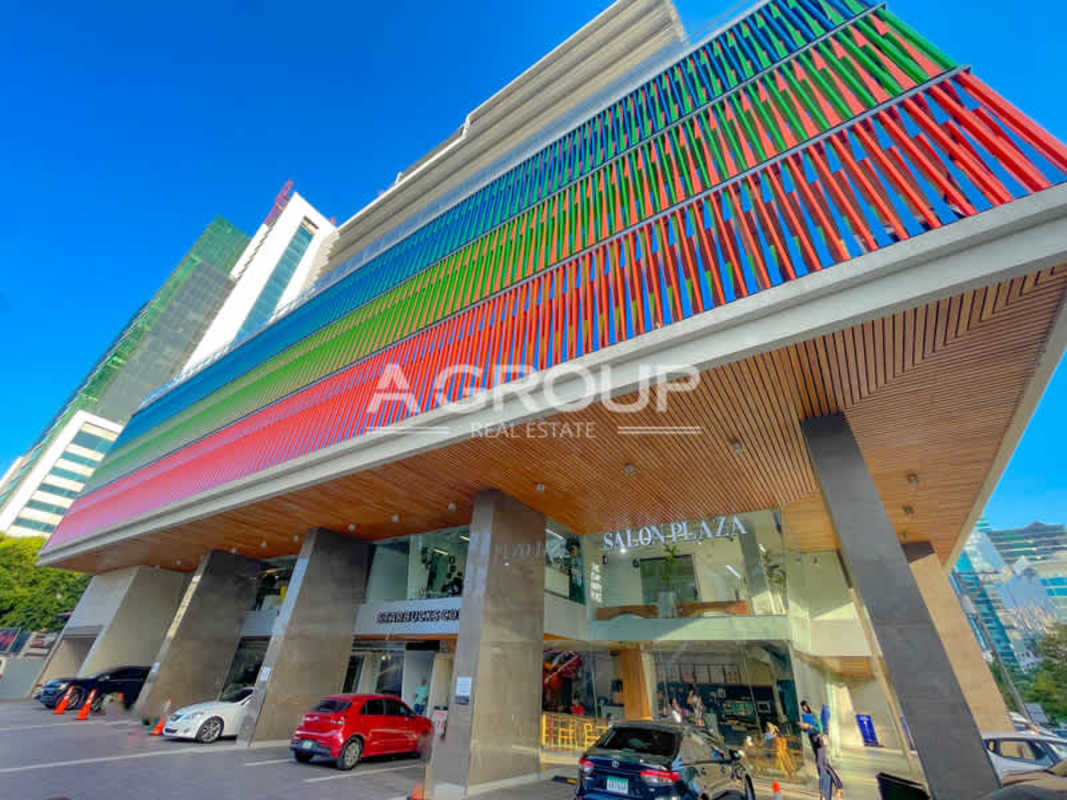 Modern commercial facade with colored vertical panels Kenex Plaza Obarrio Panama