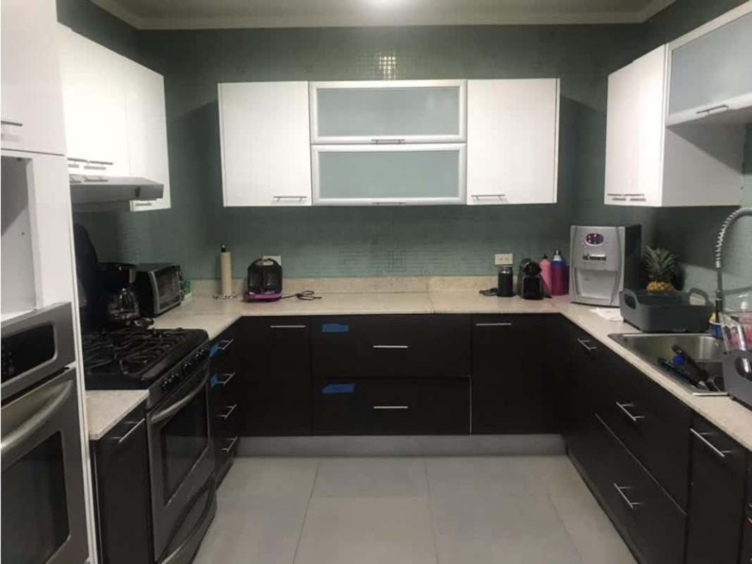 Modern dining room with large windows and natural light in PH Los Delfines Panama