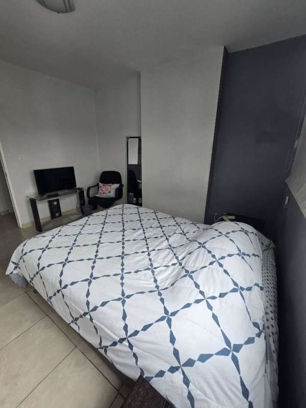 Modern bedroom with large window city skyline view marble floor Marbella Tower Panama