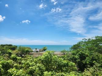 Bedroom with sliding glass doors opening to balcony, sea view at Gorgona villa Playa Coronado