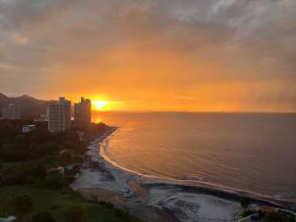 Large resort-style swimming pools with palm trees at Coronado Country Club Panama