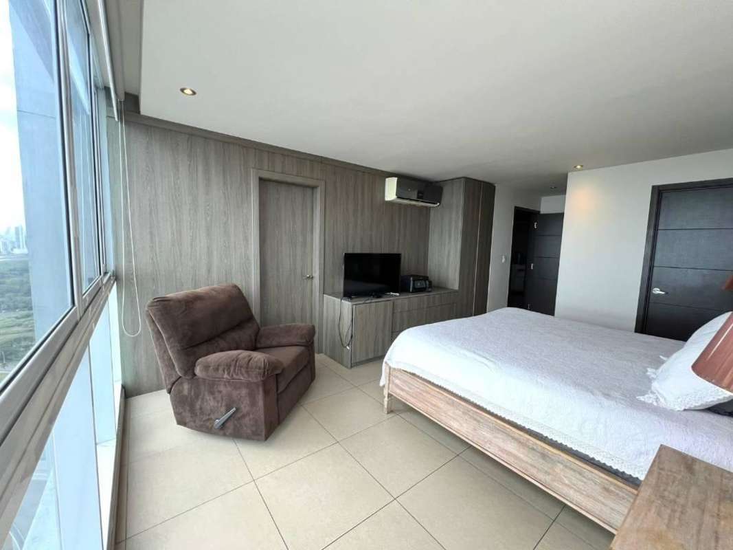 Bright bedroom with large window city view PH Titanium Costa del Este Panama