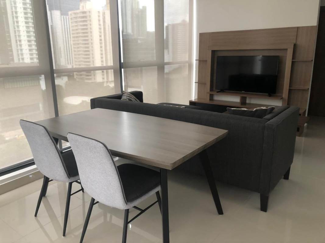 Compact kitchen with granite countertops, wood cabinets, washer dryer PH Downtown Obarrio Panama