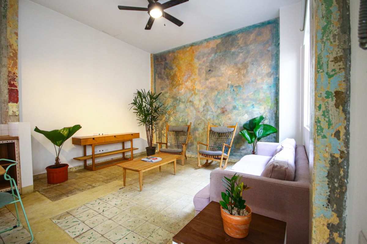Living room with rustic decor, textured wall Casco Viejo Panama rental