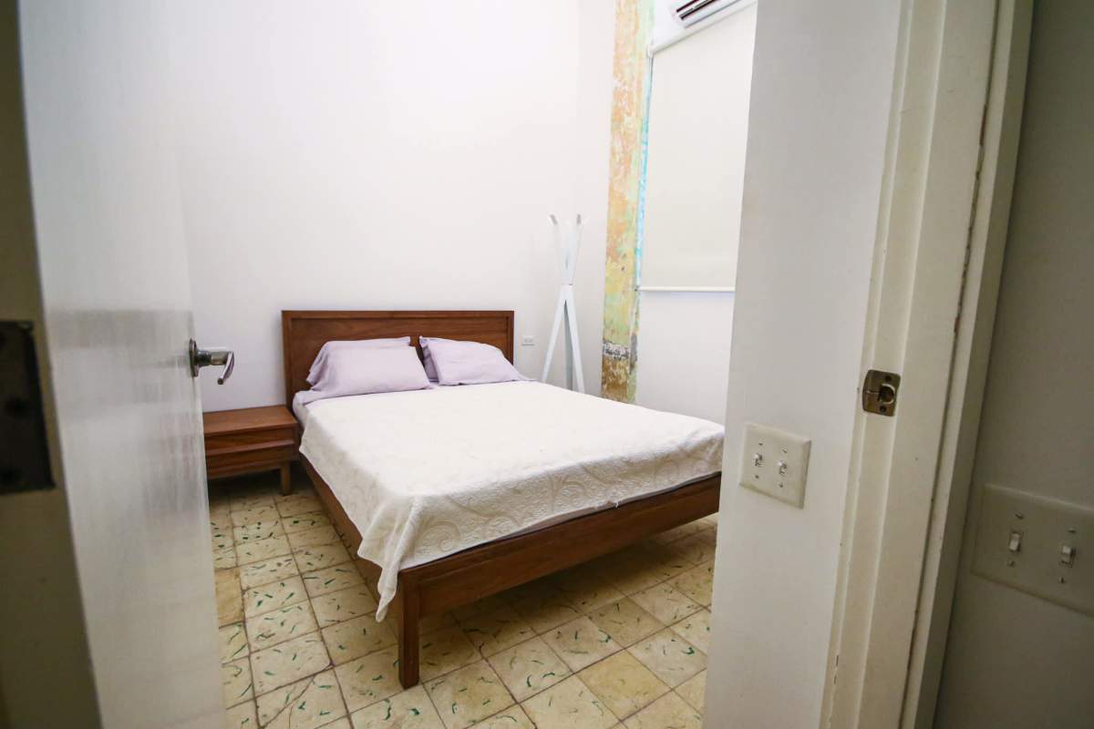 Minimalist bathroom with concrete sink and tiled shower Casco Viejo Panama rental