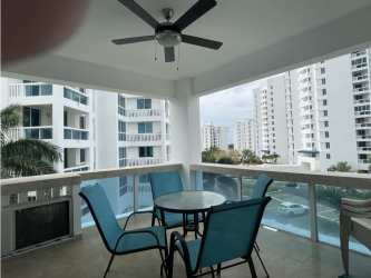 Bright open-concept living room with balcony ocean views at Founders 4 Playa Blanca Resort Panama