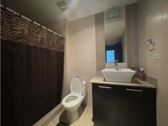 Bedroom with tile floors and direct balcony ocean views in Founders 4 Playa Blanca Panama