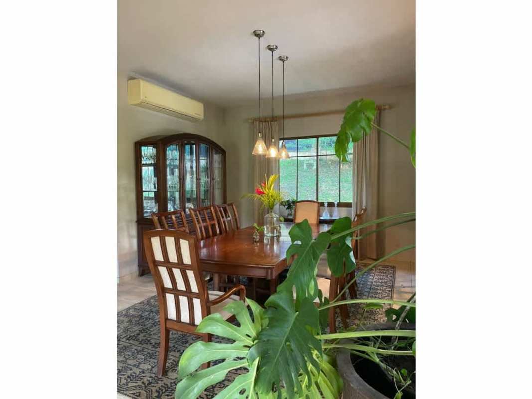 Contemporary kitchen with granite island, stainless steel appliances, breakfast area in luxury estate