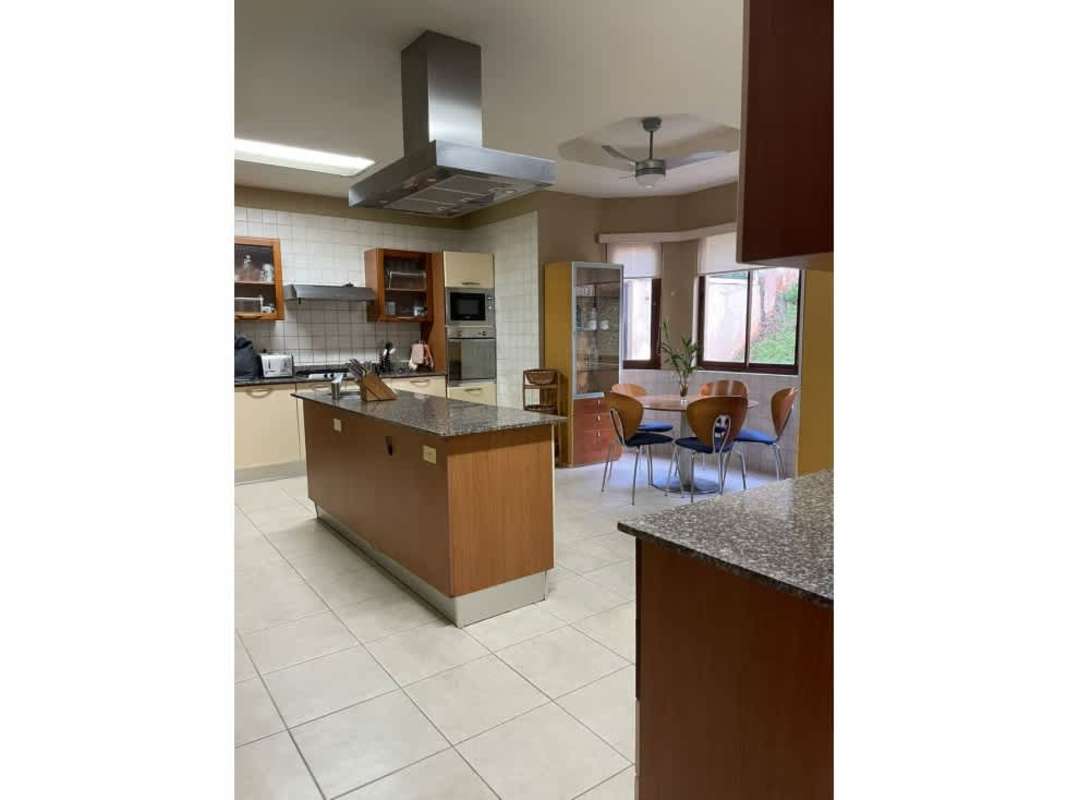 Covered terrace with fans, outdoor dining, tropical garden view Panama