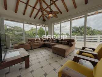 Large covered patio terrace with ceiling fans and hammock at Coronado beach vacation rental, Panama