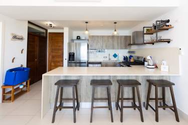 Bright coastal living room open design with ocean view Punta Caelo Panama