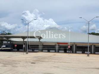 Covered truck loading docks and wide canopy warehouse entry Plaza Xtra Capira Panama