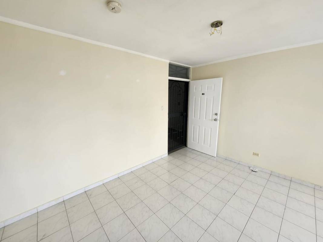 Entry door with metal security gate inside Villa Gloriela apartment Betania Panama