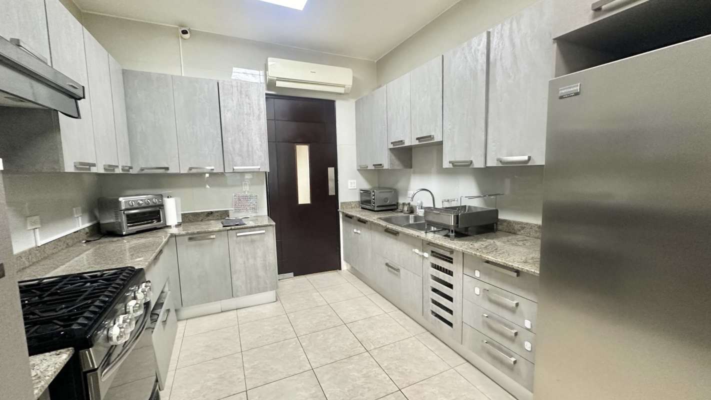 Expansive living and dining area with panoramic windows in Punta Pacifica