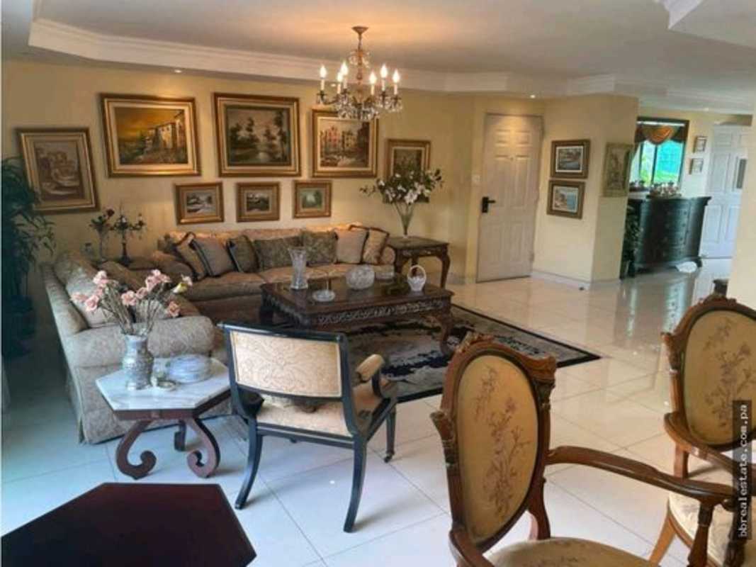 Traditional dining area with glass cabinet in Marbella Panama apartment