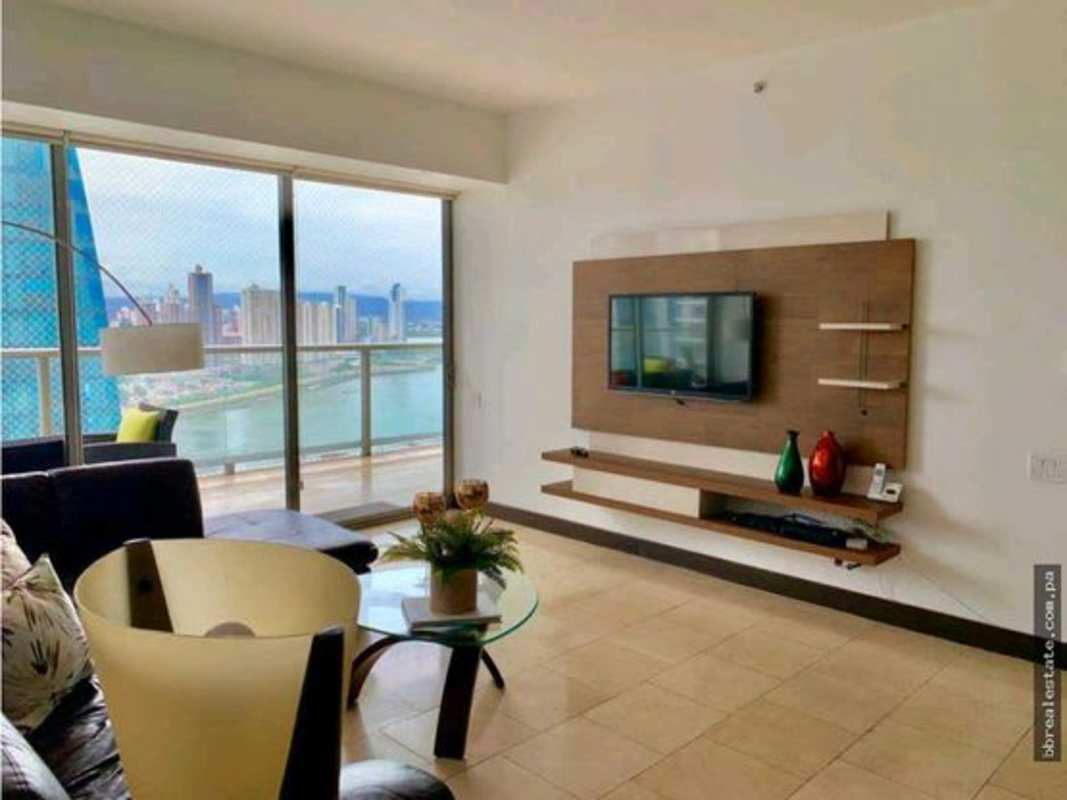 Luxury bedroom with large sliding balcony doors offering city views at PH The Ocean Club
