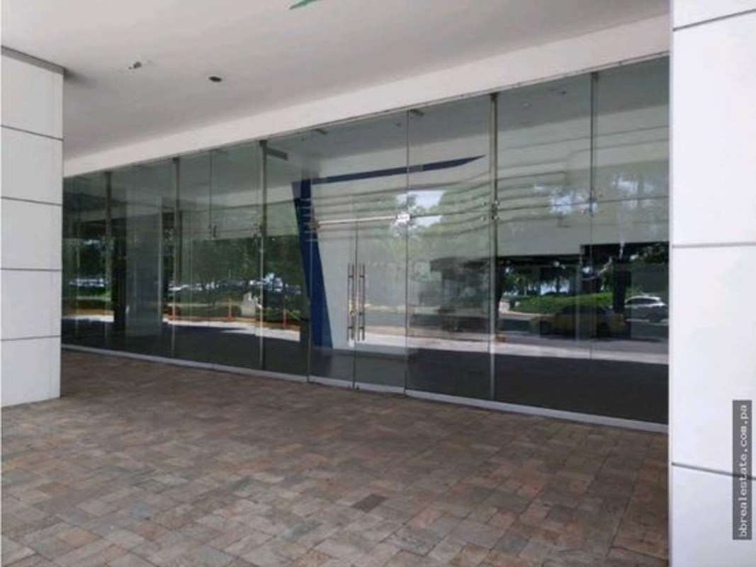 Wide glass entrance with overhang and pedestrian access at PH BICSA Tower, Avenida Balboa Panama