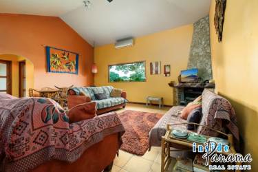 Bedroom with large glass doors, tiled floor, natural light, access to terrace overlooking gardens