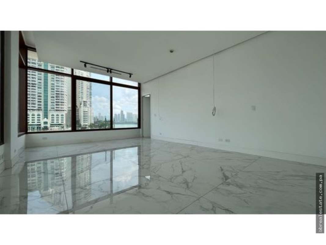 Spacious dining area with floor-to-ceiling windows and ocean marina views in PH Ocean Reef Islands Panama