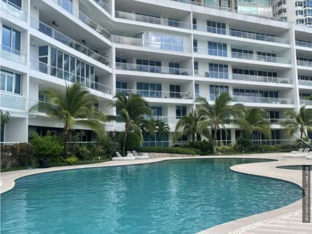 Outdoor garden and children's playground area with sea and skyline views at PH Miradores Panama