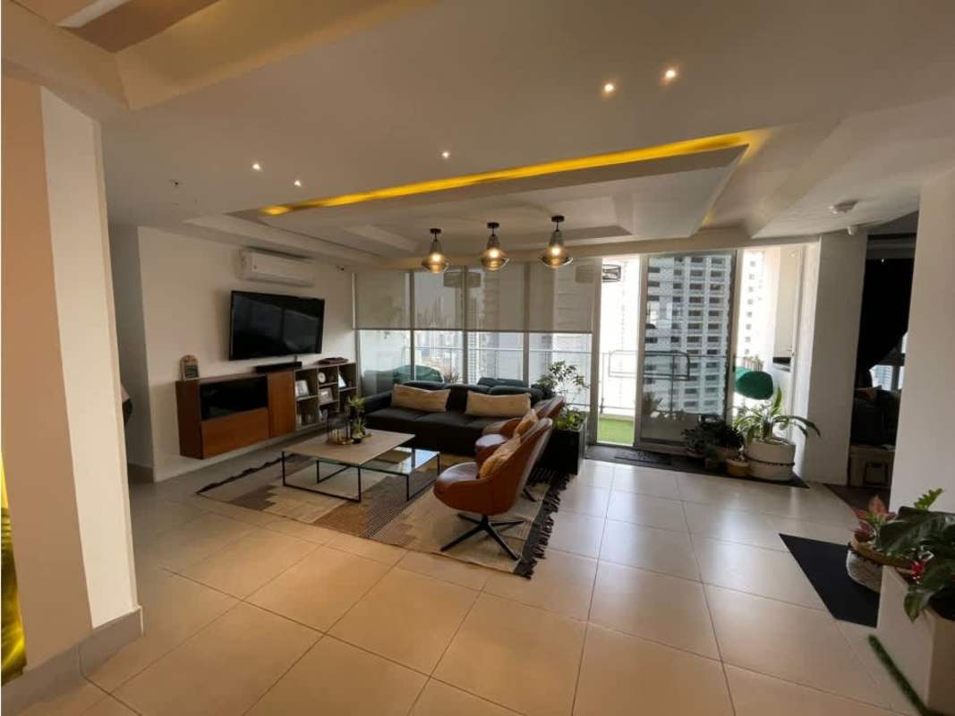 Spacious penthouse living room with access to balcony, pendant lighting in PH Park City Obarrio Panama