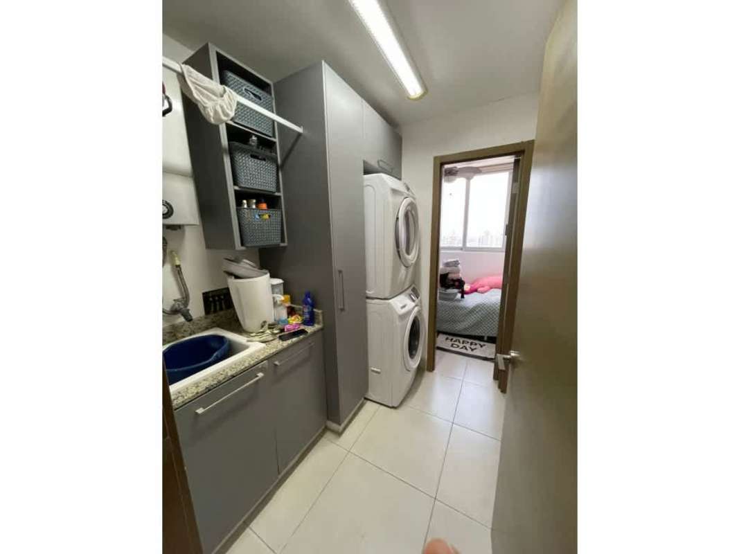 Modern laundry space with washer, dryer, cabinets in PH Park City Obarrio penthouse Panama