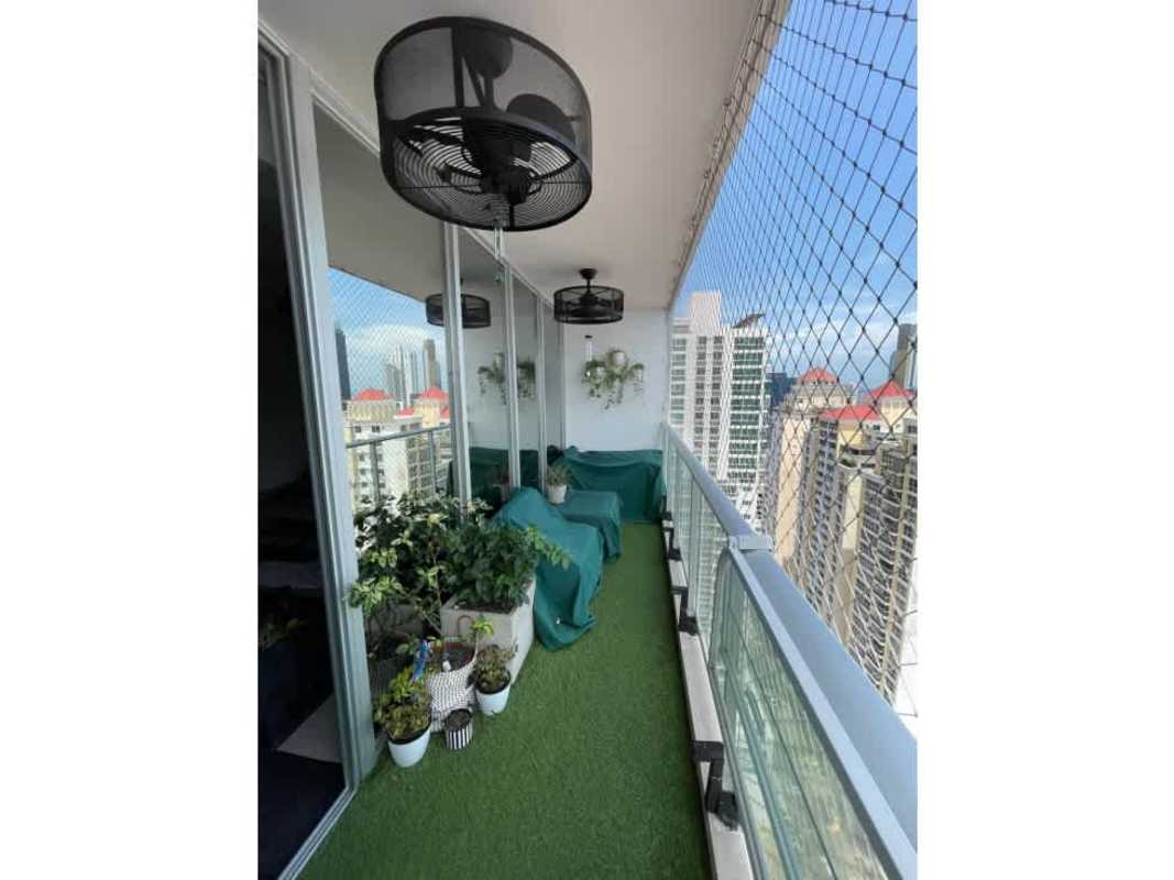 Luxury penthouse balcony with artificial grass, plants, panoramic skyline view PH Park City Obarrio Panama