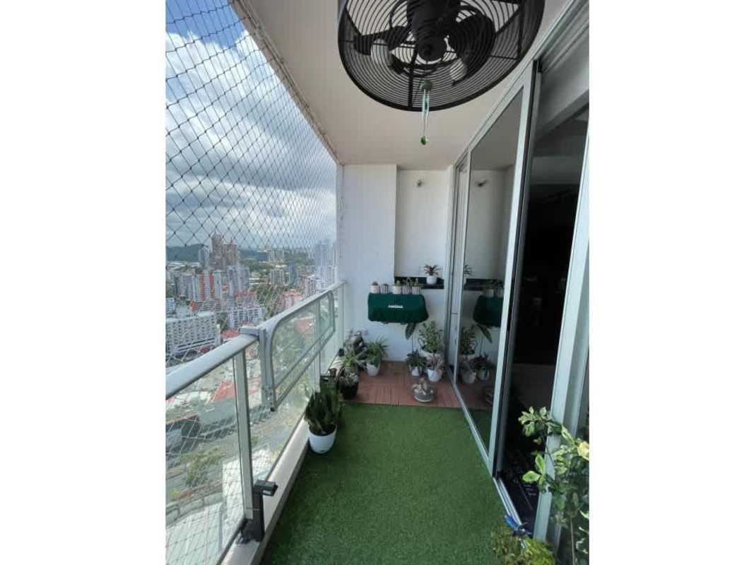 Penthouse balcony with safety net, glass railing, green turf and skyline city views in PH Park City Obarrio Panama